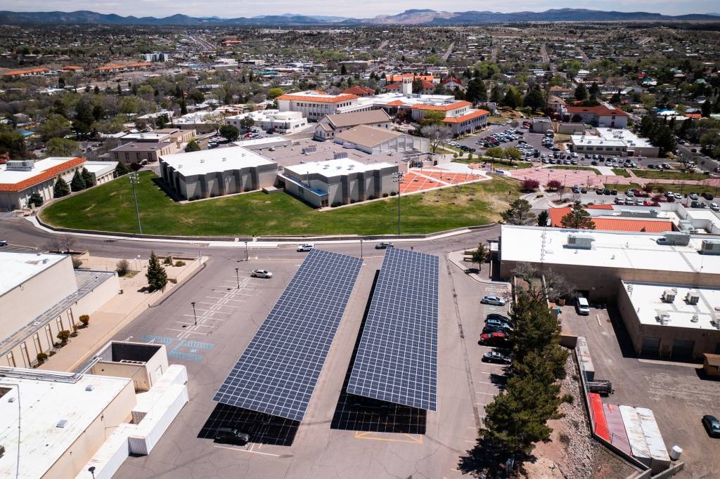 Solar awnings cover WNMU campus parking lot.