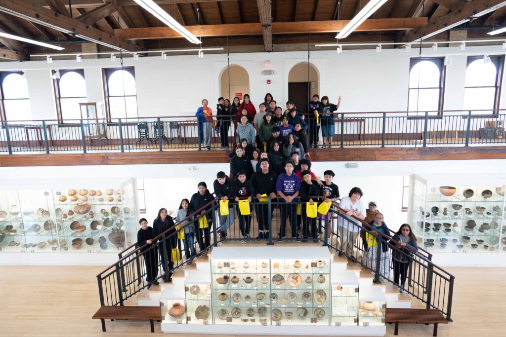 children lined up on two levels of stairs in the WNMU museum