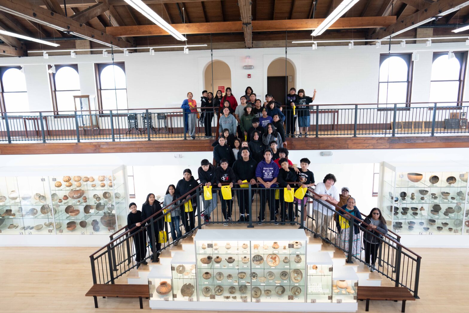 children lined up on two levels of stairs in the WNMU museum