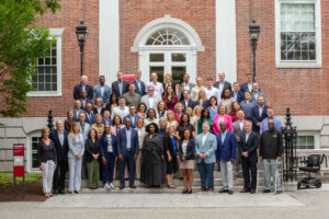 A group of people that are presidents of universities from around the world at a Harvard Presidential Leadership Seminar.